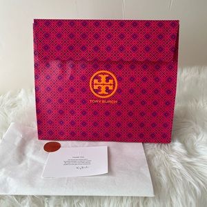 Tory Burch gift bag with Velcro closure perfect for medium size bag.